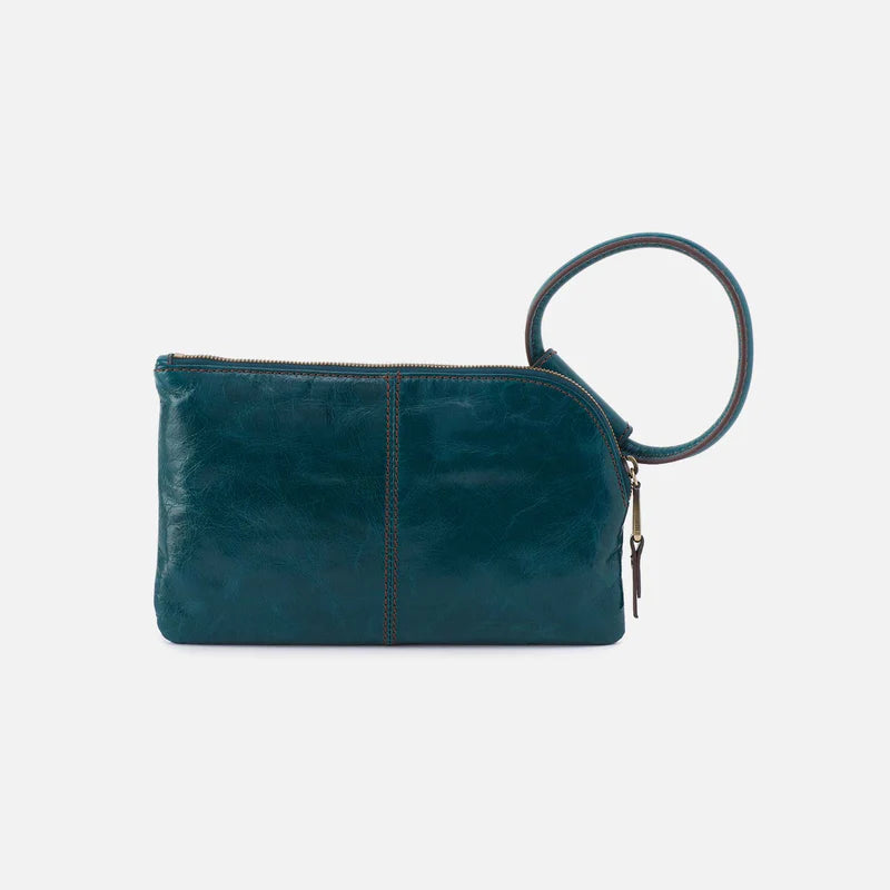 HOBO Sable Wristlet in Wild Bluegrass, styled as a clutch showing its small size and handle