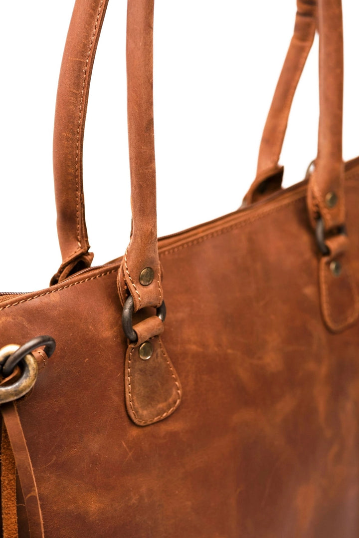 Close-up of leather handles on saddle brown handbag – Hides Leather large bag