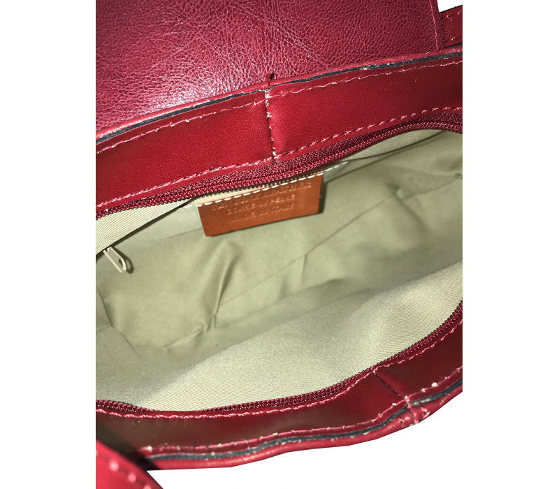 Interior view of Italian leather messenger bag showing organized storage and craftsmanship by Fior di Loto.