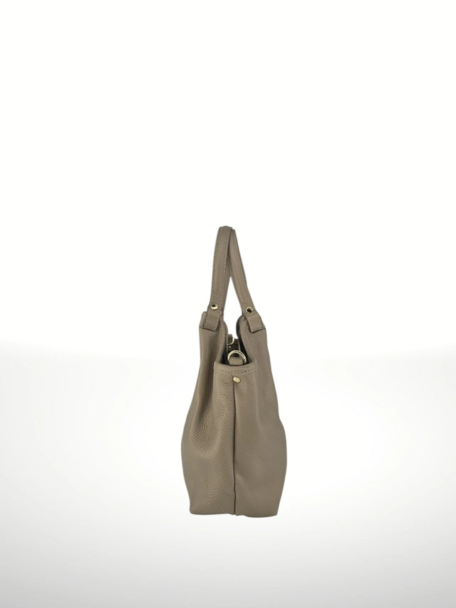 Side view of Kelli Italian pebbled leather bag in taupe showing structured profile