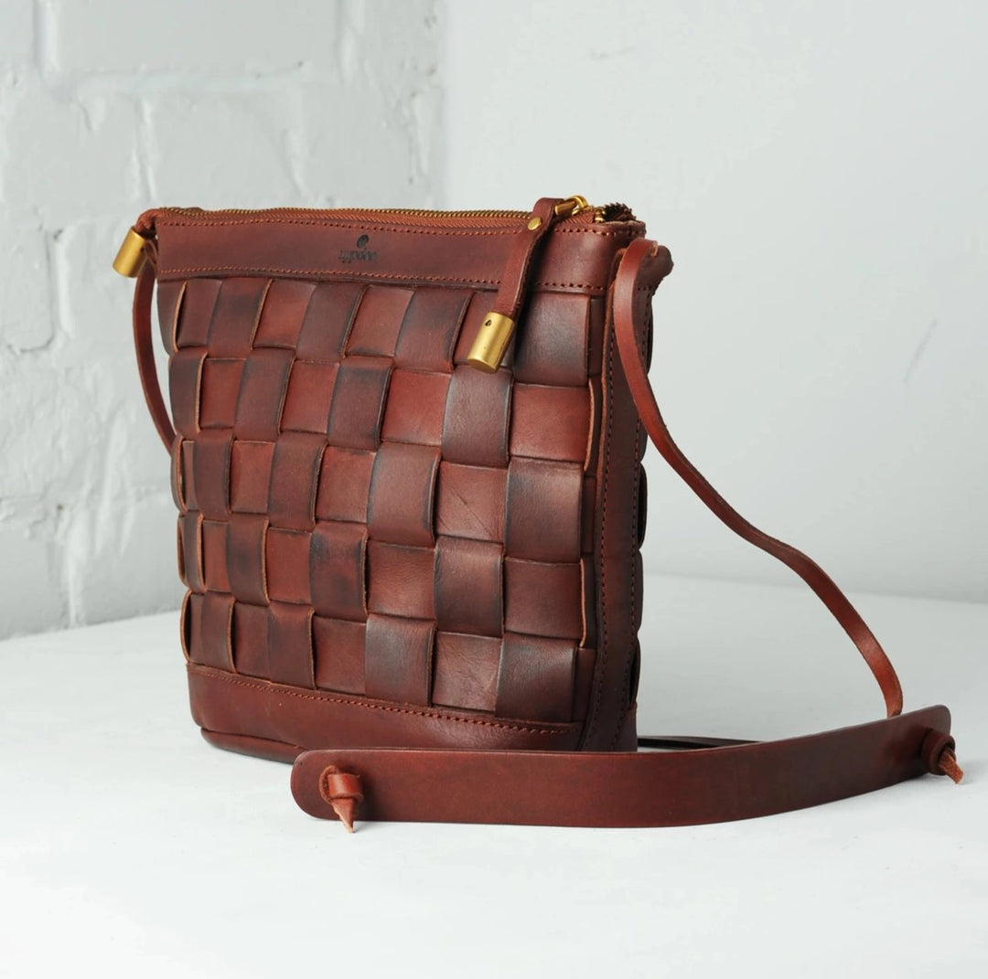 Side view of Uppdoo Venture Crossbody Bag in Chestnut Vachetta leather showing profile and depth