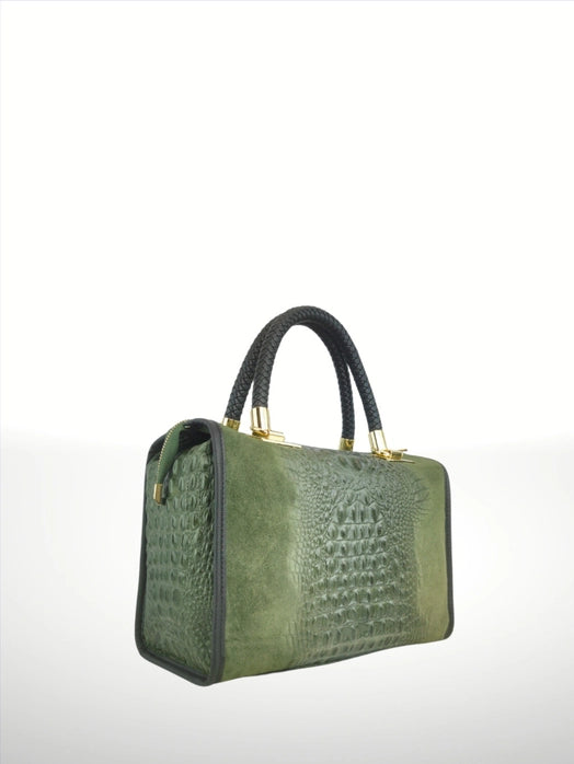 Side angle view of an Baulia Italian artisan suede leather handbag, showing semi-rigid structure and shoulder strap.