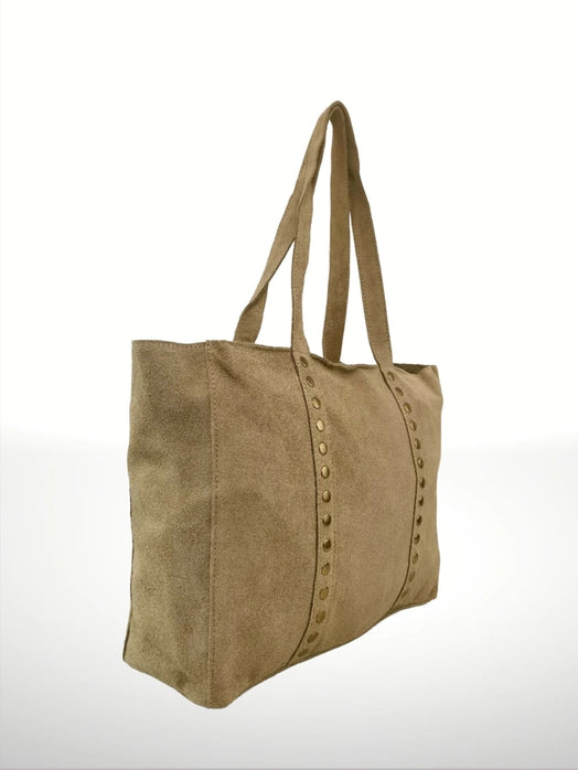 Side angle view of an Italian artisan leather shoulder bag, showing clean lines and zippered top closure.