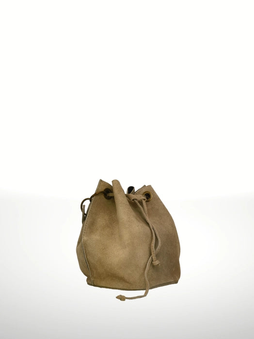 Side angle view of an Italian artisan suede leather bucket bag, showing bucket shape, metal eyelet handle detail, and removable strap.