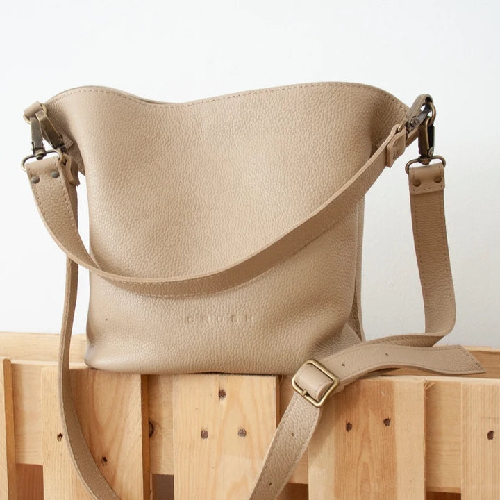 Beige Mae Spanish leather shoulder bag, front view showcasing structured silhouette and full-grain leather texture