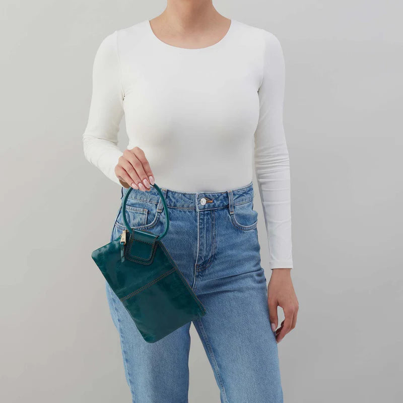 Angled view of HOBO Sable Wristlet in Wild Bluegrass with circular leather wristlet strap
