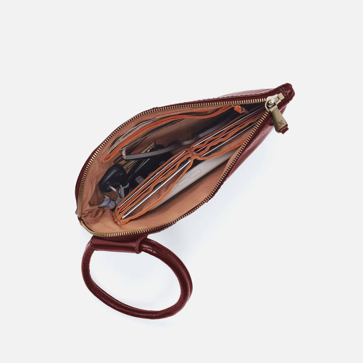 Top view of HOBO Sable Wristlet in Saddleberry with open zipper and interior