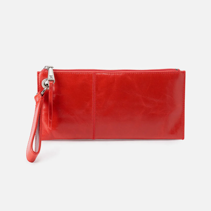 Front view of HOBO Vida Wristlet handbag in vibrant grenadine 
leather, showcasing sleek design and premium craftsmanship